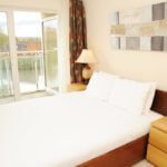 City Centre Serviced Apartments Cardiff - Corporate Short Let Accommodation Cardiff with Pool, Gym, Sauna, Parking, Lift & Balcony | Urban Stay