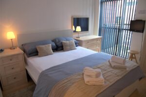 Our Corporate Apartments Manchester have private balconies, Wifi, Smart TVs and king size beds. Book your Manchester accommodation now!