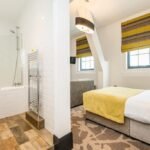 Discover Ainscow Serviced Apartments for premium extended stay accommodation. Ideal for business and leisure with modern amenities. | Urban Stay