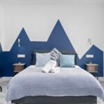 Book Salford Manchester Short Lets. Spacious 4-bedroom house with WiFi, parking, and  transport links to MediaCityUK & Manchester city centre.
