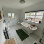 Book large pet friendly holiday cottages in Lincolnshire. This 6-bedroom house in Spalding is for up to 10 guests with parking and garden.
