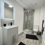 Stay in stylish Holiday Apartments West Yorkshire. Our 2-bed serviced apartments in Yeadon have parking, and easy transport to Leeds.