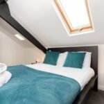 Stay at Group Accommodation in Gateshead. Spacious home near Newcastle with parking, transport links, and easy access to attractions & hubs.